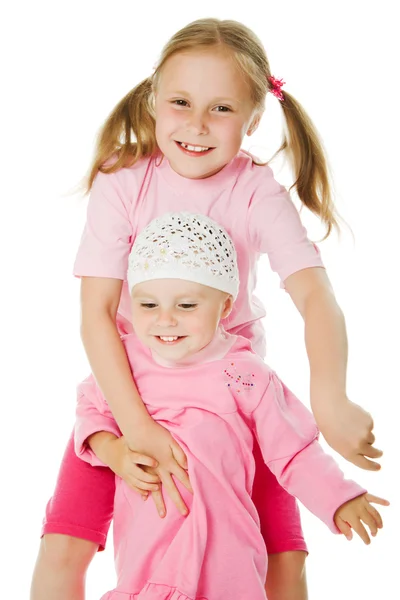 Big sister, little sister hugging — Stock Photo, Image