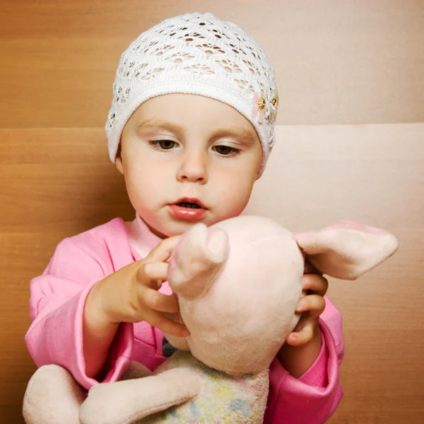 Little girl with plush toy. — Stock Photo, Image