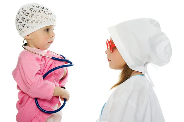 Merry children playing as doctor and patient — Stock Photo, Image