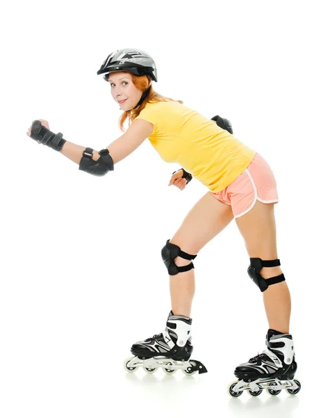 Mooie jonge vrouw op rolschaatsen — Stockfoto