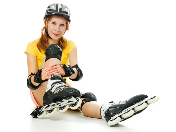 Belle jeune femme sur patins à roulettes — Photo