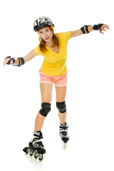 Mooie jonge vrouw op rolschaatsen — Stockfoto