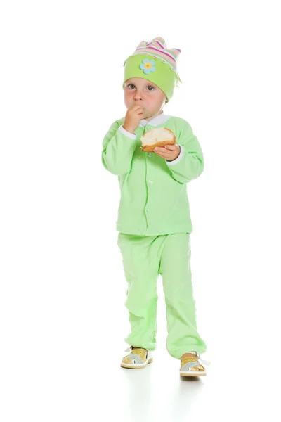 Cute baby eats the bread — Stock Photo, Image