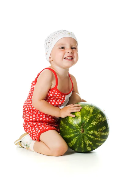 An adorable baby happily plays the watermelon — Stock Photo, Image