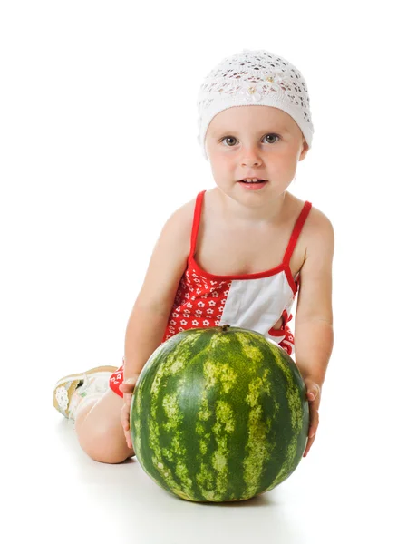 An adorable baby happily plays the watermelon — Stock Photo, Image