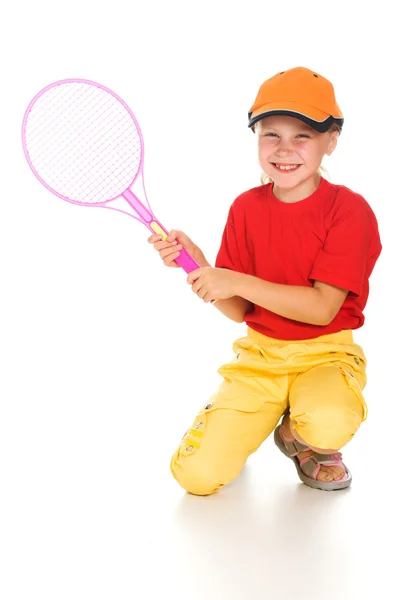 Liten flicka med spelar tennis — Stockfoto