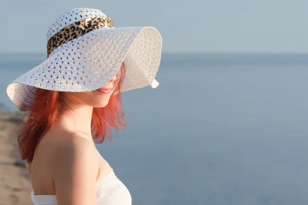 Beautiful woman in white hat — Stock Photo, Image