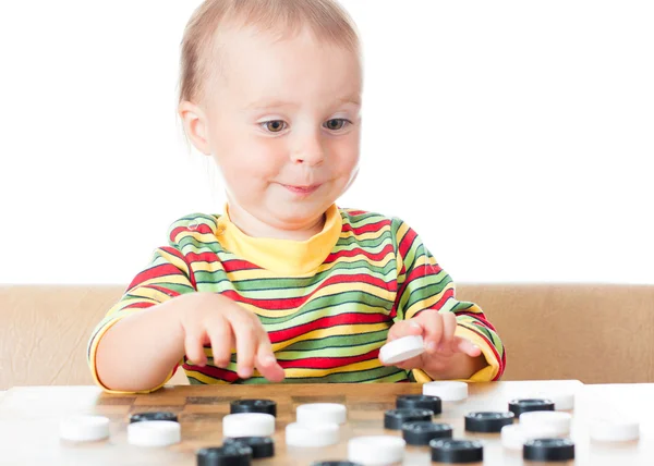 Miúdo a jogar damas . — Fotografia de Stock