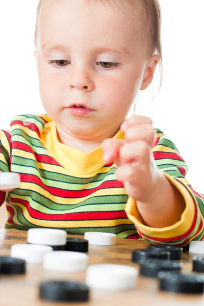 Niño jugando damas . — Foto de Stock