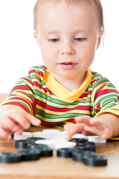 Dziecko grając w warcaby. — Zdjęcie stockowe