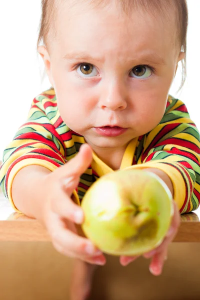 Baby with the rotten apple. — Stock Photo, Image