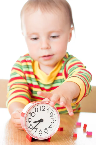 Little cute baby with clock Stock Image