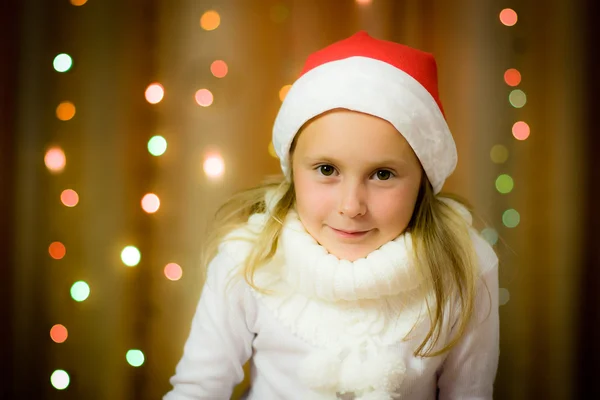 Usmívající se dívka v santa hat — Stock fotografie