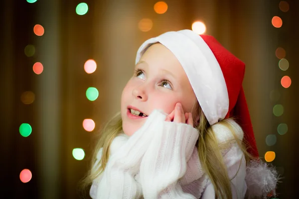Smiling girl in santa hat — Stock Photo, Image