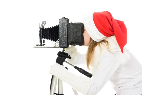 Menina em um traje de Natal com câmera velha — Fotografia de Stock