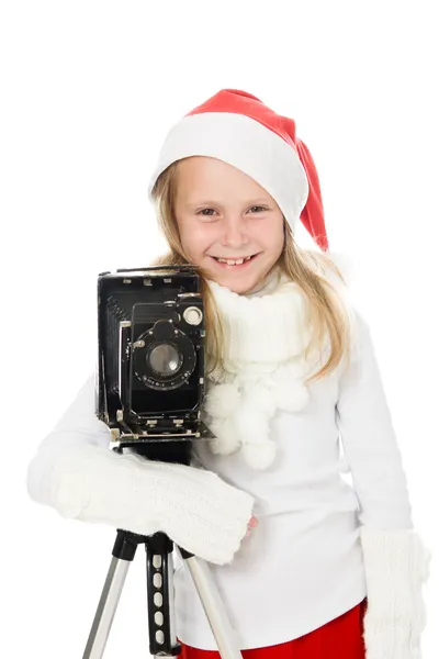 Mädchen im Weihnachtskostüm mit alter Kamera — Stockfoto