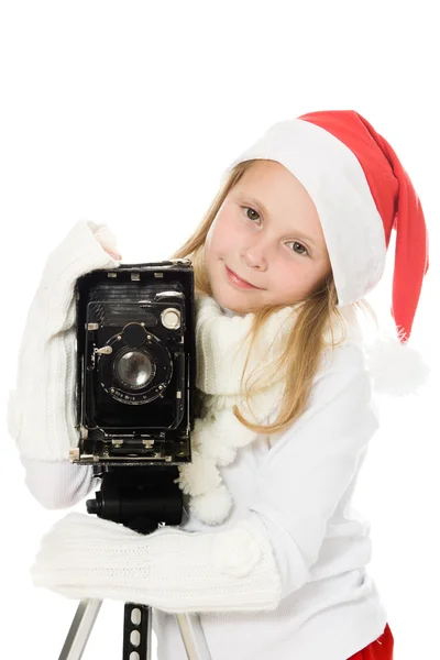 Mädchen im Weihnachtskostüm mit alter Kamera — Stockfoto