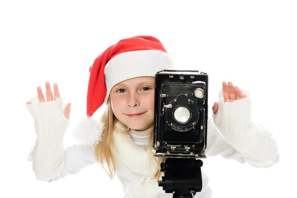 Chica en un disfraz de Navidad con cámara vieja — Foto de Stock
