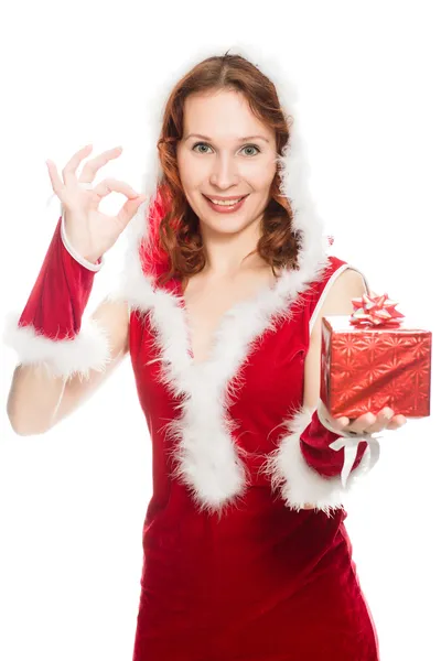 Happy girl in a Christmas dress showing okay sign — Stock Photo, Image
