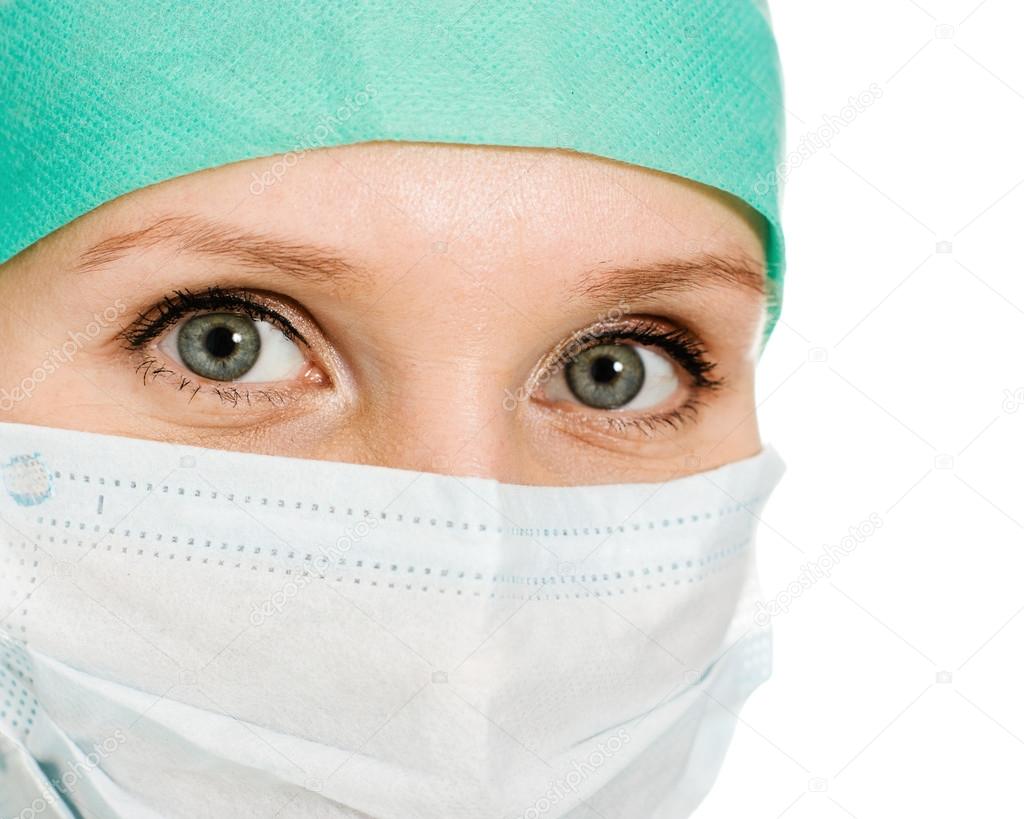 Surgeon woman in protective mask