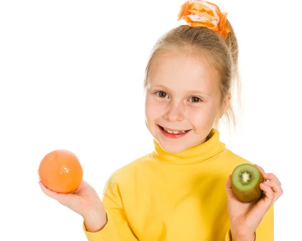 Cute girl with an apple and kiwi in his hand — Stock Photo, Image
