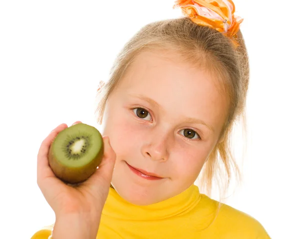 Cute girl with an kiwi in his hand — Stock Photo, Image