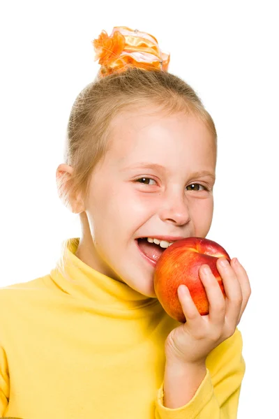 Cute girl biting an apple — Stock Photo, Image