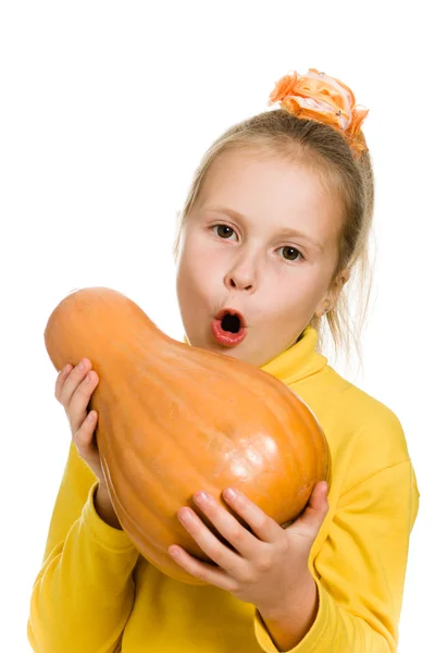 Cheerful girl holding a pumpkin — Stock Photo, Image