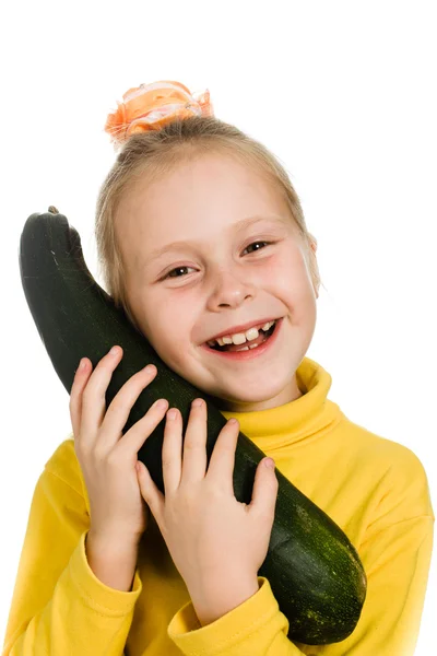 Cheerful girl hugs zucchini — Stock Photo, Image