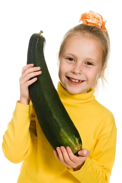 Cheerful girl holding zucchini — Stock Photo, Image