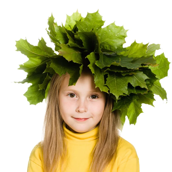 Little girl with green maple leaves on the head — Stock Photo, Image