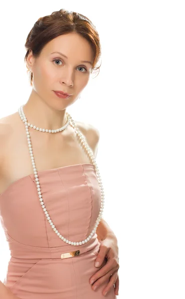 Schöne Mädchen in einem Kleid und Perlen — Stockfoto