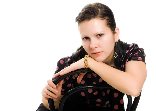 Sad woman in retro style sitting on a chair — Stock Photo, Image