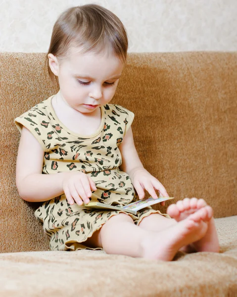 Beautiful cute baby reading a book — Stock Photo, Image