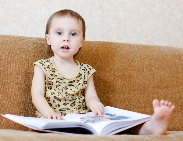 Beautiful cute baby reading a book — Stock Photo, Image
