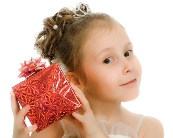 Pretty girl in a beautiful dress with gift — Stock Photo, Image