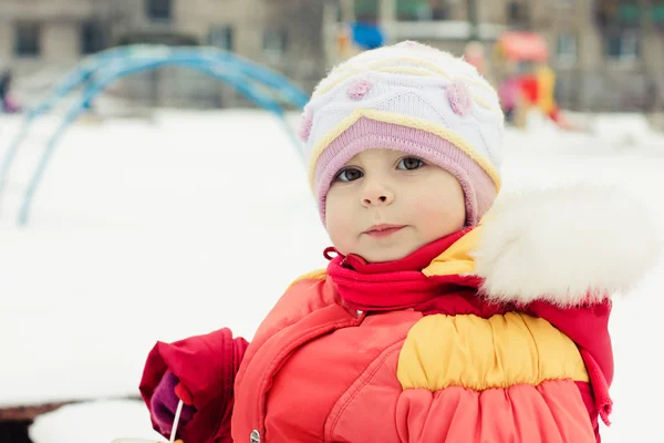 Beautiful happy kid in the red jacket — Stock Photo, Image