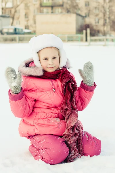 Beautiful happy girl in the red jacket — Stock Photo, Image