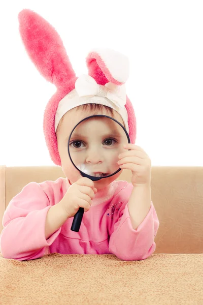 Baby rabbit ears sitting at a table — Stock Photo, Image