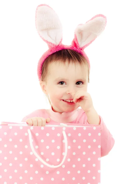 The little girl with pink ears bunny and bag. — Stock Photo, Image