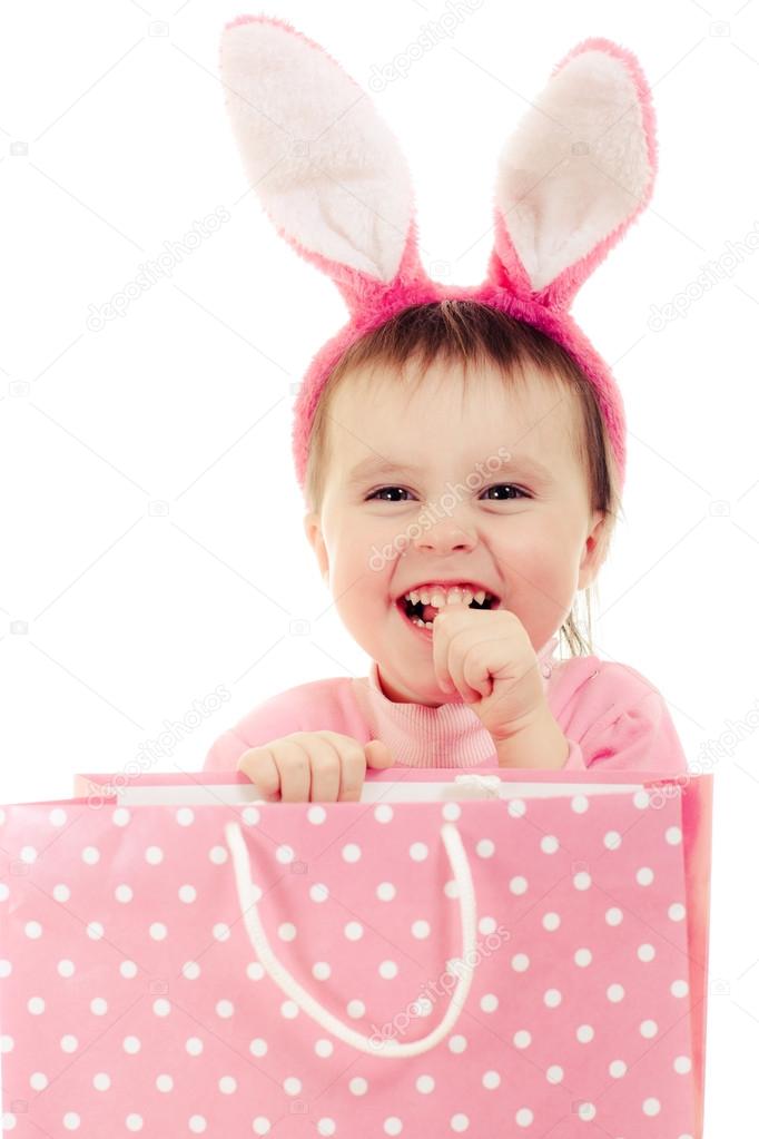 The little girl with pink ears bunny and bag.