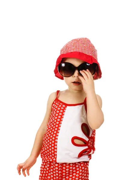 Niño en el sombrero rojo y gafas de sol —  Fotos de Stock