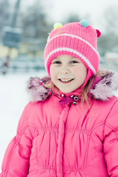 Beautiful happy girl in the red jacket. — Stock Photo, Image