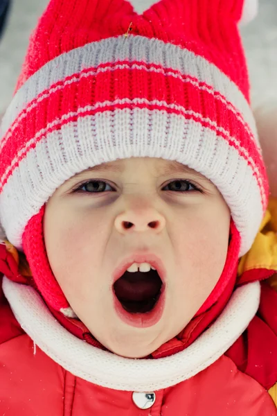 Beautiful happy kid in the red hat — Stock Photo, Image