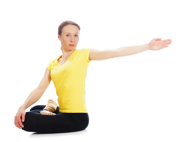 Young woman doing yoga exercise Stock Photo