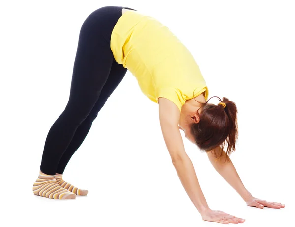 Young woman doing yoga exercise Stock Picture