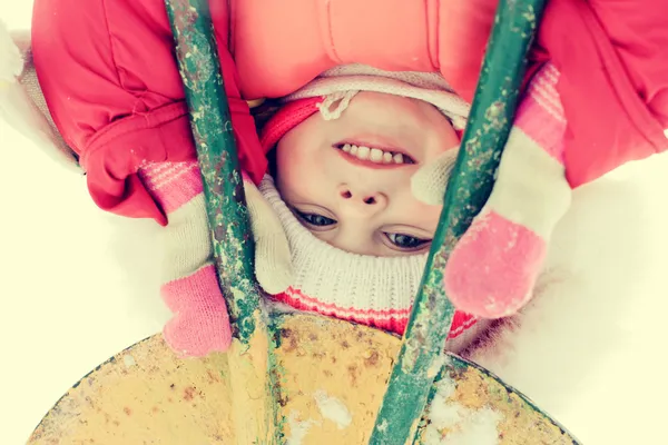 Beautiful happy kid in the red warm clothing — Stock Photo, Image