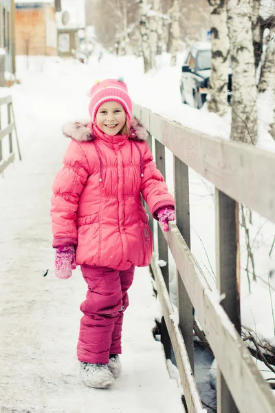 Beautiful happy kid in the red jacket — Stock Photo, Image