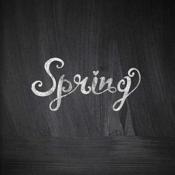Chalk drawing card with "Spring" lettering on chalkboard blackboard — Stock Photo, Image