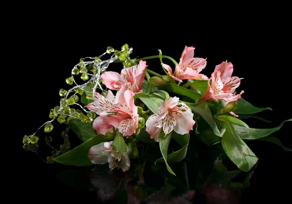 Bouquet of pink lilies on a black — Stock Photo, Image